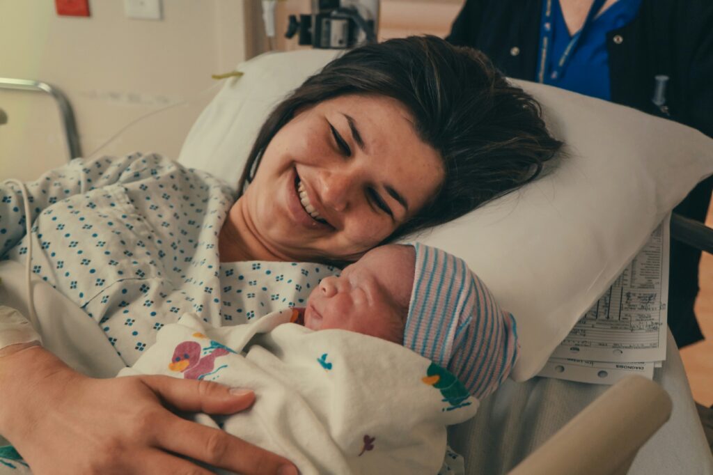 A parent holding a newborn